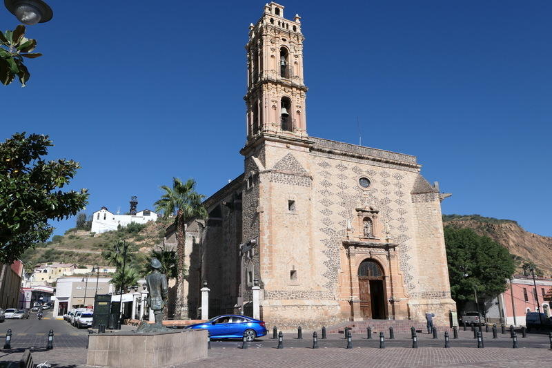 Parral's main church with the mine lurking behind